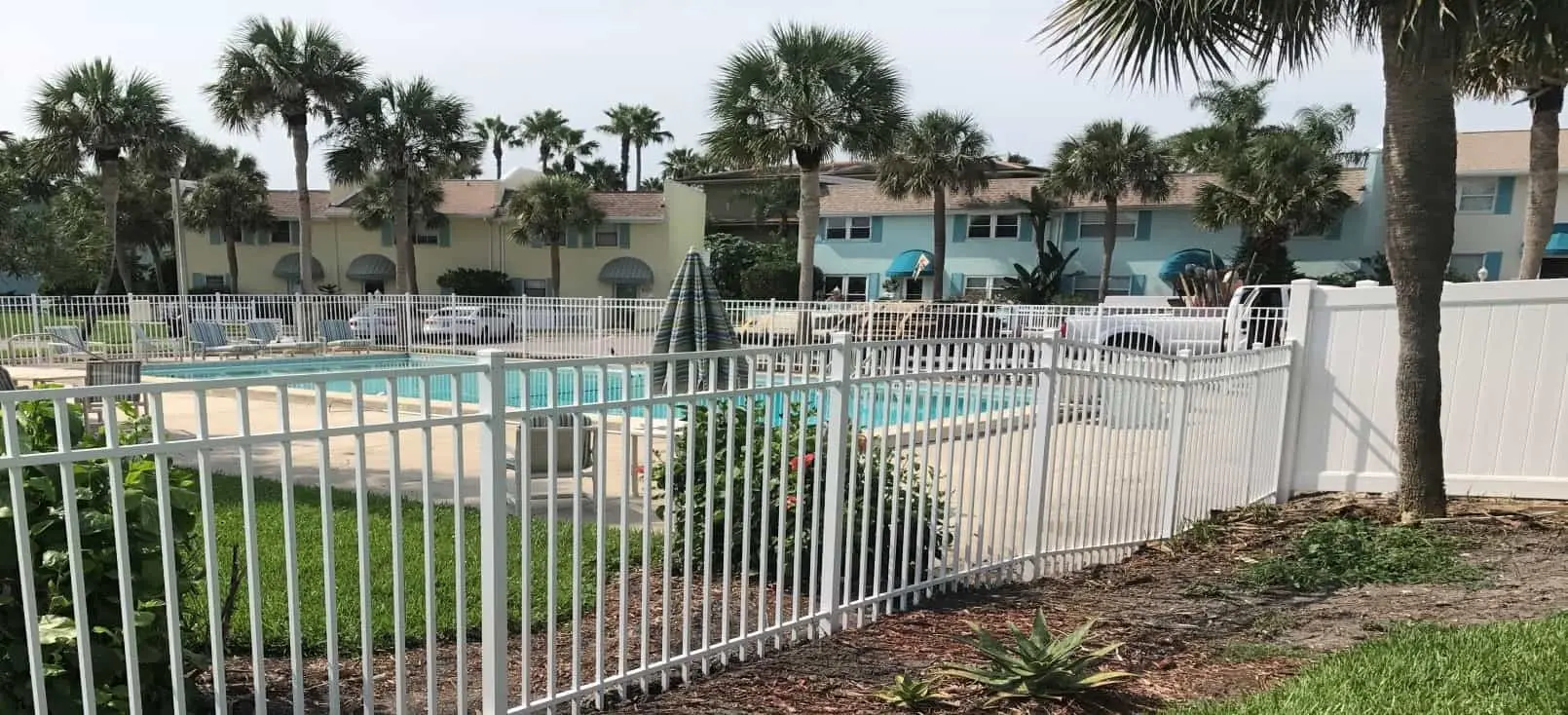 A New Fence Keeps Your Pool Safe and Sparkling Clean this Summer